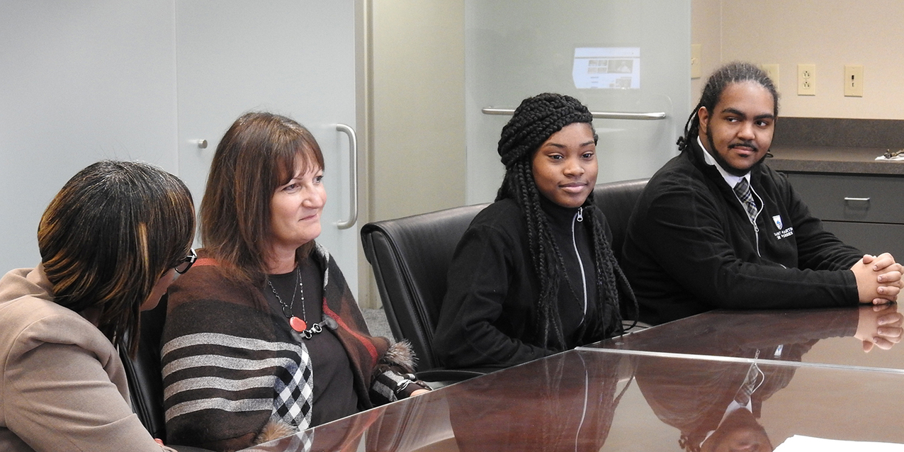 St. Martin de Porres High School diocesan work-study interns spend lunch hour with Archbishop-designate Perez 
