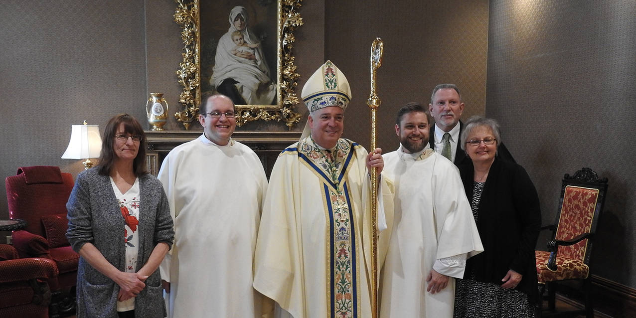 Two men ordained as transitional deacons on the path to priesthood