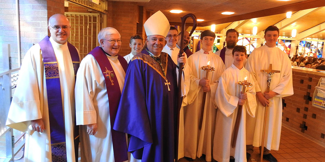 Bishop Perez celebrates Mass, mingles with students at Holy Family School in Stow