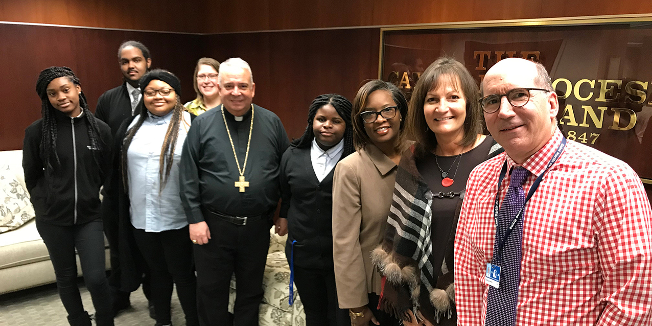 St. Martin de Porres High School diocesan work-study interns spend lunch hour with Archbishop-designate Perez 