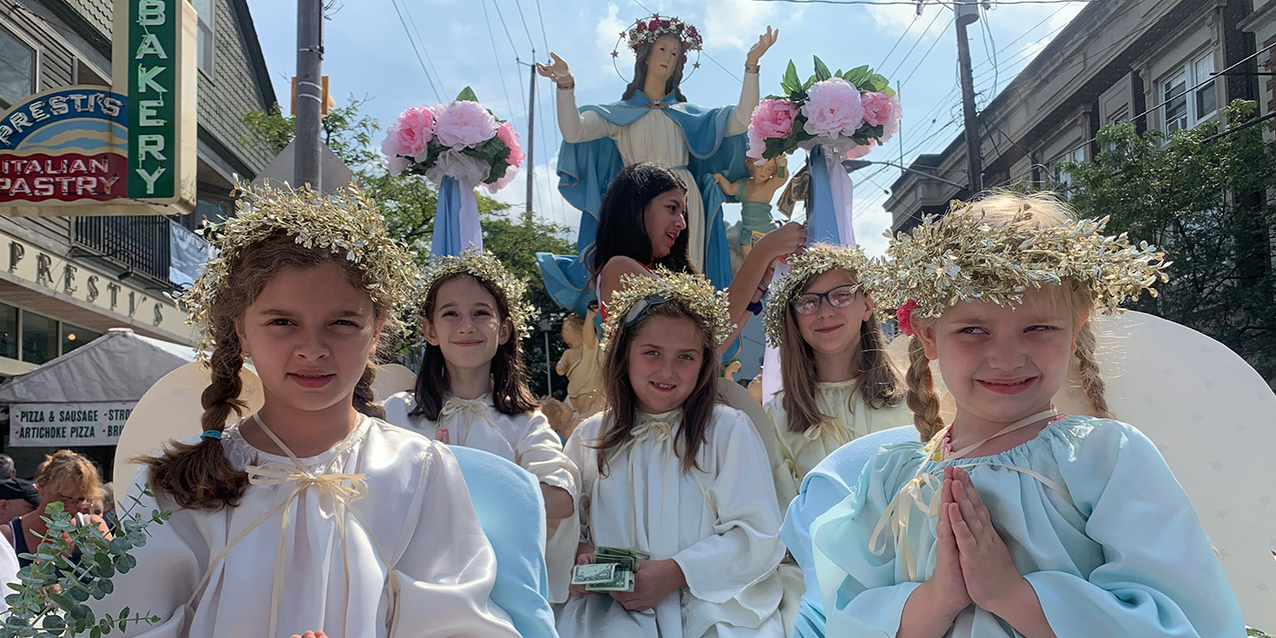 Faithful jam Holy Rosary Church for Mass as the feast of the Assumption celebration begins