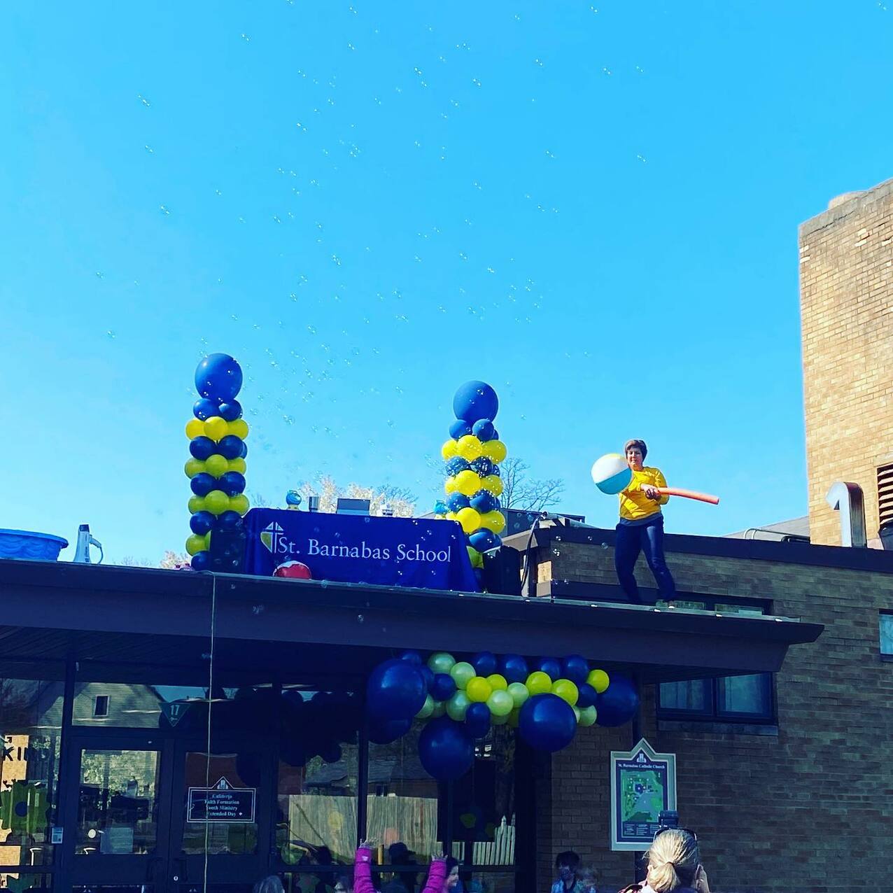 St. Barnabas School principal heads to the roof to fulfill a bargain with students