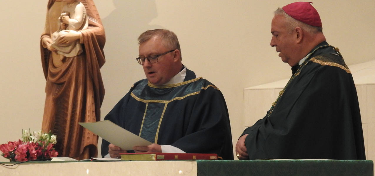 Father John Mullee installed as pastor at St. Michael Parish, Independence