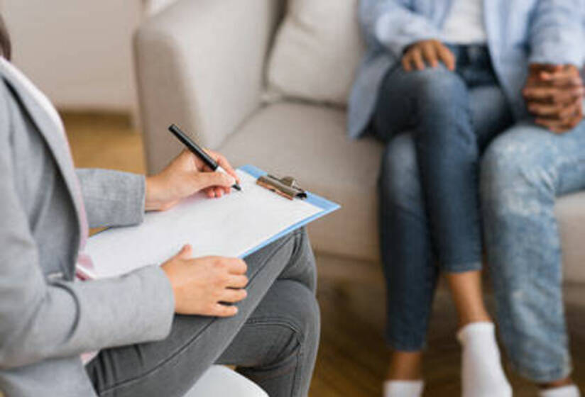 Couple sitting with clipboard